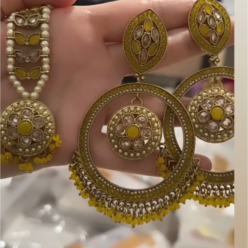 Yellow ear rings with tikka